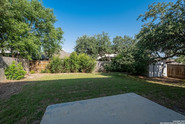 10217 Sandbrook, San Antonio, TX 78254 - fenced backyard featuring a storage unit and a patio area
