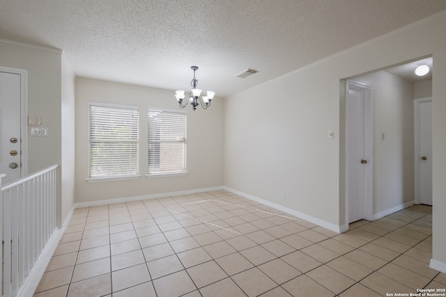 10217 Sandbrook, San Antonio, TX 78254 - spare room with a chandelier, ornamental molding, a textured ceiling, and light tile patterned floors