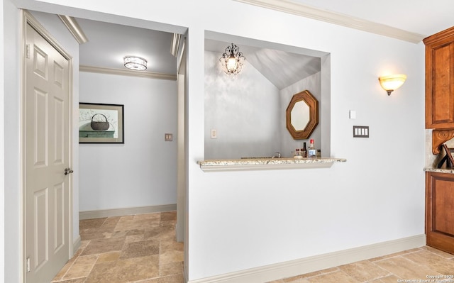 16018 Alsace, San Antonio, TX 78232 - hallway with stone tile flooring, ornamental molding, and a chandelier