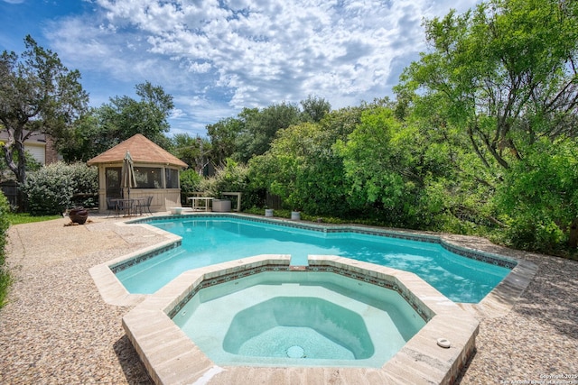 16018 Alsace, San Antonio, TX 78232 - view of pool featuring a gazebo, a pool with connected hot tub, and view of wooded area