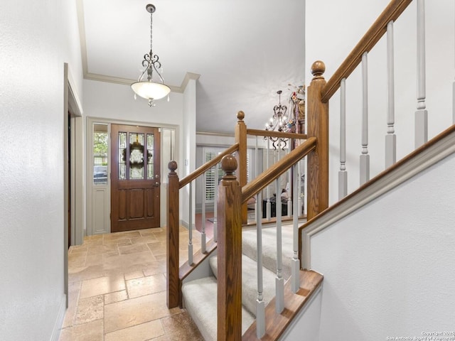 16018 Alsace, San Antonio, TX 78232 - entrance foyer featuring stone tile floors, stairs, crown molding, and a chandelier