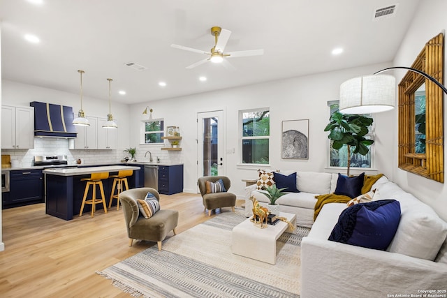 1939 W French Pl, San Antonio, TX 78201 - living area featuring light wood-type flooring, a ceiling fan, and recessed lighting