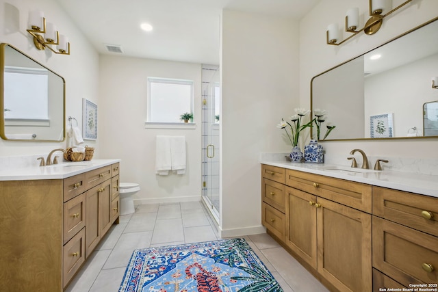 1939 W French Pl, San Antonio, TX 78201 - full bathroom featuring two vanities, a stall shower, and tile patterned floors