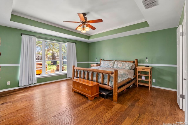 19502 Encino Bow, San Antonio, TX 78259 - bedroom with a raised ceiling, wood finished floors, crown molding, and a ceiling fan
