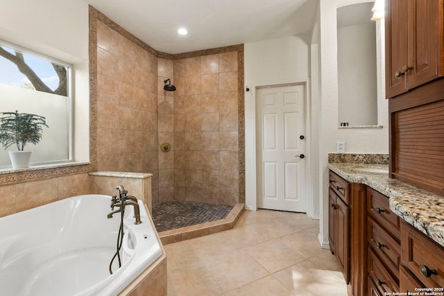 19502 Encino Bow, San Antonio, TX 78259 - bathroom featuring a tile shower, a bath, tile patterned floors, and vanity
