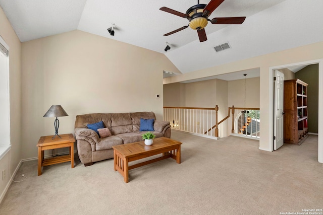 19502 Encino Bow, San Antonio, TX 78259 - living room featuring ceiling fan, vaulted ceiling, light carpet, and plenty of natural light