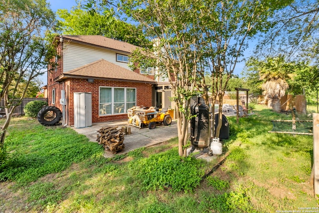 19502 Encino Bow, San Antonio, TX 78259 - back of house featuring brick siding, a patio area, and roof with shingles