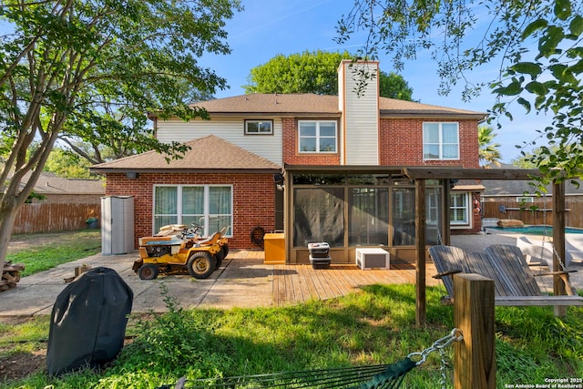 19502 Encino Bow, San Antonio, TX 78259 - back of property with a fenced backyard, brick siding, a chimney, a shingled roof, and a deck