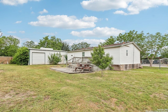 1111 Valeria, Marion, TX 78124 - rear view of house featuring a wooden deck, an outbuilding, and a detached garage
