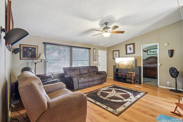 1111 Valeria, Marion, TX 78124 - living area with a ceiling fan, wood finished floors, a textured ceiling, and lofted ceiling