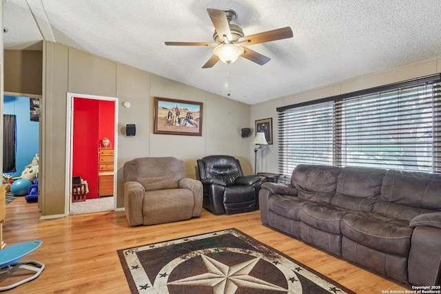 1111 Valeria, Marion, TX 78124 - living area with lofted ceiling, plenty of natural light, a textured ceiling, a ceiling fan, and wood finished floors