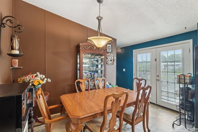 1111 Valeria, Marion, TX 78124 - dining area featuring french doors, a textured ceiling, and vaulted ceiling