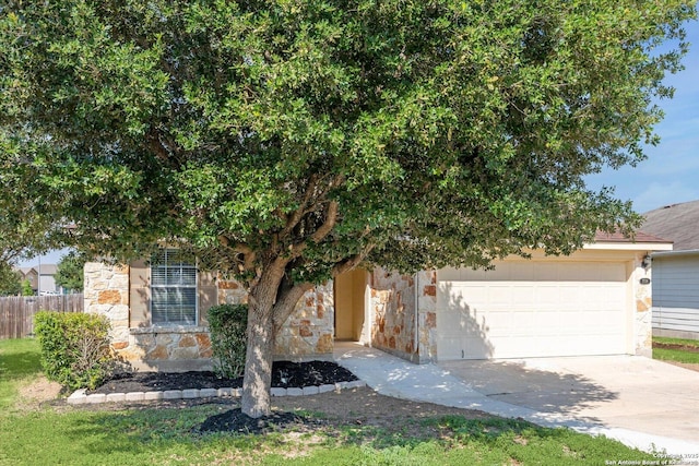7738 Brisbane Bnd, Converse, TX 78109 - obstructed view of property with stone siding, a garage, and driveway