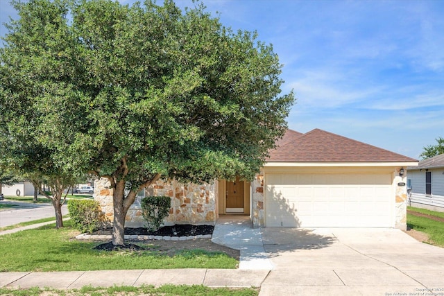 7738 Brisbane Bnd, Converse, TX 78109 - view of front of property with an attached garage, driveway, stone siding, and a shingled roof