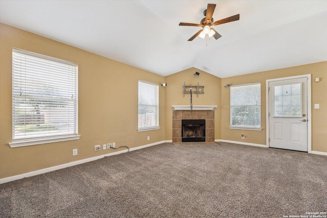 7738 Brisbane Bnd, Converse, TX 78109 - unfurnished living room with a ceiling fan, vaulted ceiling, carpet, and a tile fireplace