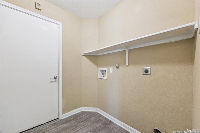 7738 Brisbane Bnd, Converse, TX 78109 - washroom with hookup for a gas dryer, wood finished floors, washer hookup, and electric dryer hookup