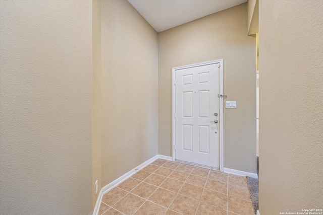 7738 Brisbane Bnd, Converse, TX 78109 - doorway featuring baseboards and light tile patterned floors