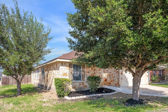 7738 Brisbane Bnd, Converse, TX 78109 - view of front of property with stone siding, concrete driveway, and a garage