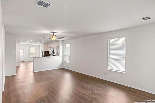 759 Crested Iris, New Braunfels, TX 78130 - unfurnished living room with dark wood-type flooring, a ceiling fan, and recessed lighting