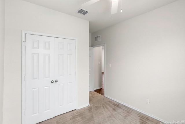 759 Crested Iris, New Braunfels, TX 78130 - unfurnished bedroom with carpet, a closet, and a ceiling fan