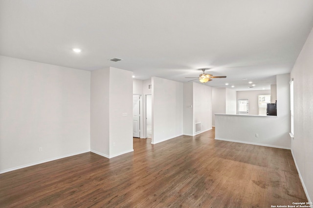 759 Crested Iris, New Braunfels, TX 78130 - unfurnished living room with dark wood-style floors, ceiling fan, and recessed lighting