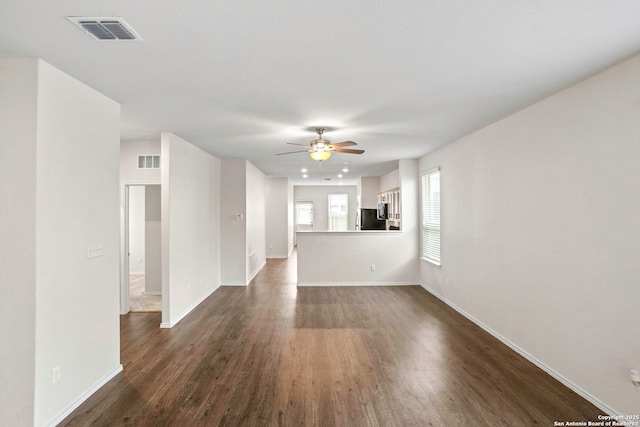 759 Crested Iris, New Braunfels, TX 78130 - unfurnished living room featuring dark wood-type flooring and ceiling fan
