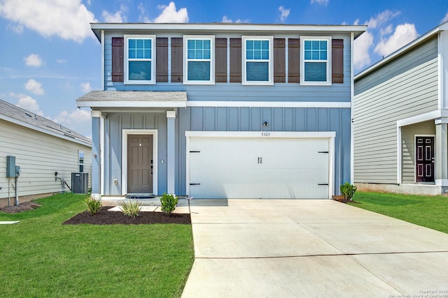 5323 Flying Hooves, San Antonio, TX 78222 - view of front of house featuring board and batten siding, a garage, a front yard, and concrete driveway