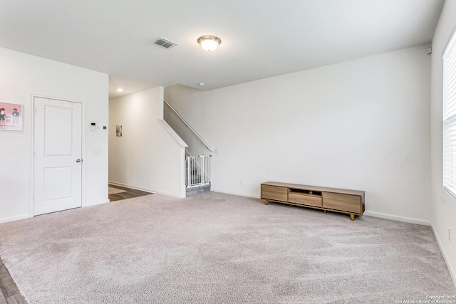5323 Flying Hooves, San Antonio, TX 78222 - carpeted spare room with stairs and baseboards