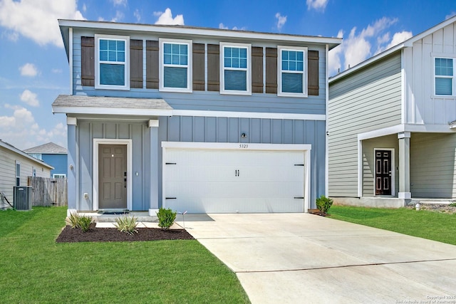 5323 Flying Hooves, San Antonio, TX 78222 - view of front facade with an attached garage, board and batten siding, and concrete driveway