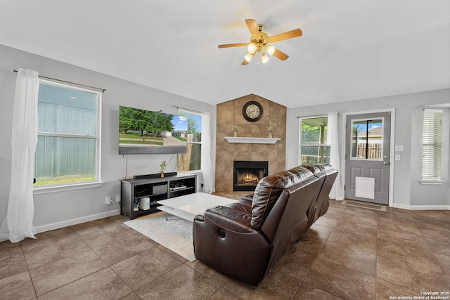 9511 Autumn Run, Converse, TX 78109 - living room featuring a tiled fireplace, lofted ceiling, and a ceiling fan