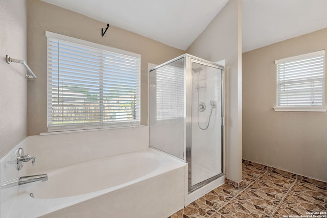 9511 Autumn Run, Converse, TX 78109 - bathroom with plenty of natural light, a stall shower, and a garden tub