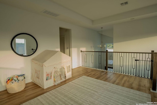137 Mescalero, Boerne, TX 78006 - hallway featuring a chandelier and wood finished floors