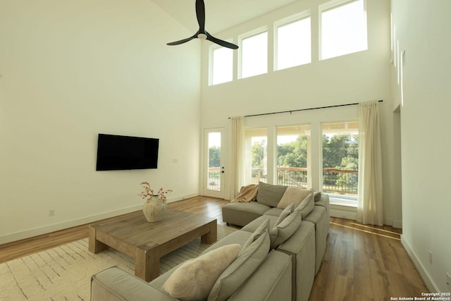 137 Mescalero, Boerne, TX 78006 - living area with ceiling fan, a towering ceiling, and wood finished floors