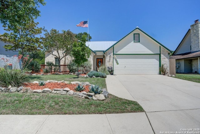 201 Cibolo Xing, Boerne, TX 78006 - view of front of property featuring an attached garage, a front lawn, stone siding, and driveway