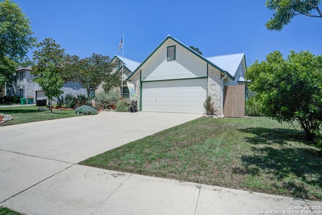201 Cibolo Xing, Boerne, TX 78006 - view of front of property with stone siding, a front lawn, driveway, and a garage