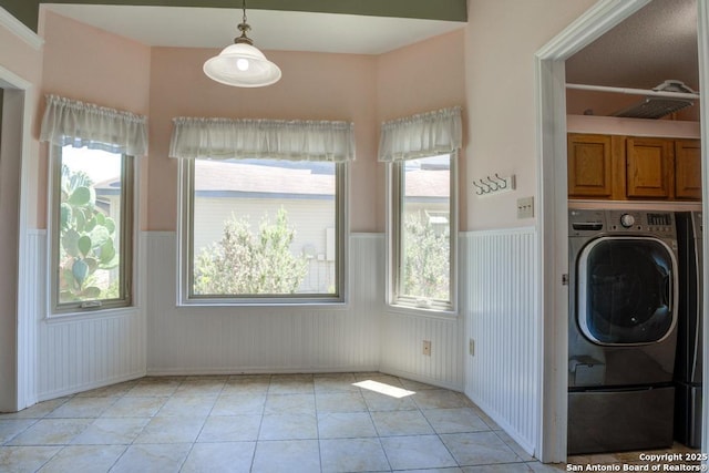 201 Cibolo Xing, Boerne, TX 78006 - washroom with washer / clothes dryer, wainscoting, cabinet space, light tile patterned floors, and plenty of natural light