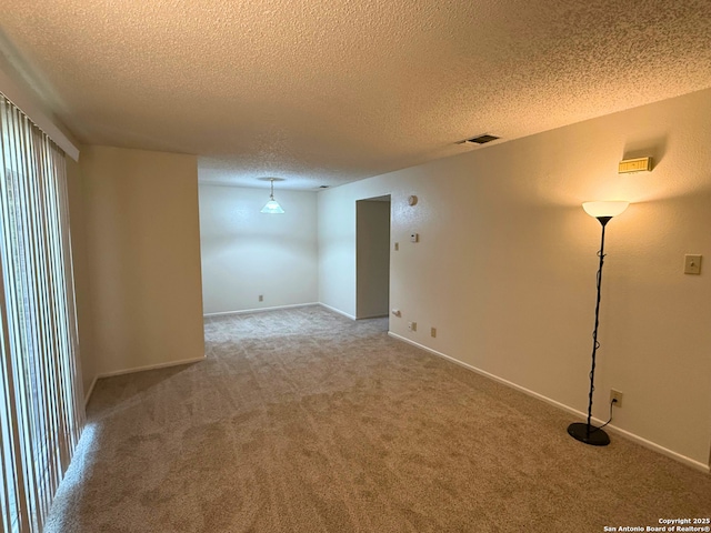 13018 Heimer Unit 805, San Antonio, TX 78216 - carpeted spare room with a textured ceiling and baseboards