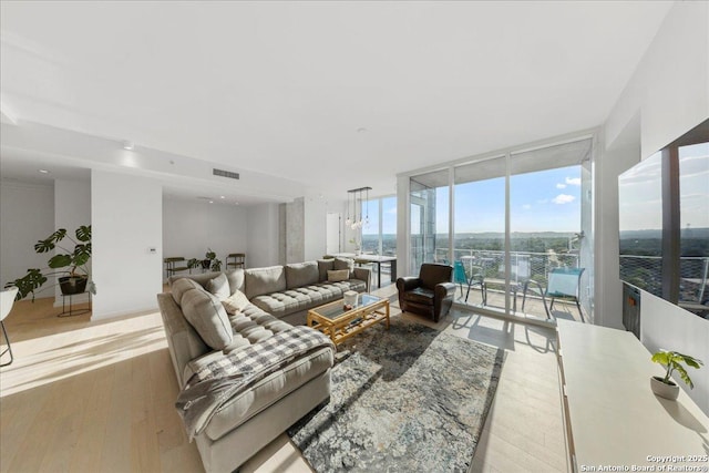 313 17th Unit, Austin, TX 78701 - living area featuring floor to ceiling windows and wood finished floors
