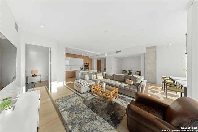 313 17th Unit, Austin, TX 78701 - living area featuring light wood-type flooring