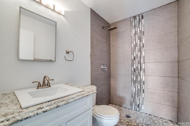 7711 Chatsworth, San Antonio, TX 78250 - bathroom featuring tiled shower and vanity