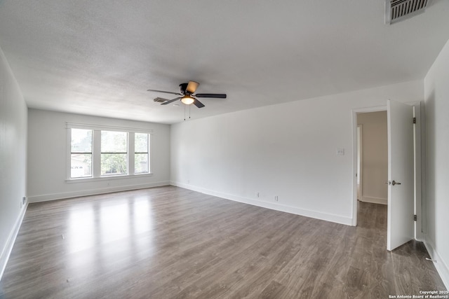 7711 Chatsworth, San Antonio, TX 78250 - spare room featuring wood finished floors and a ceiling fan