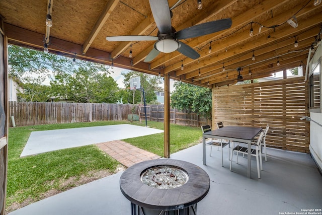 7711 Chatsworth, San Antonio, TX 78250 - fenced backyard with a patio, a fire pit, a ceiling fan, and outdoor dining area