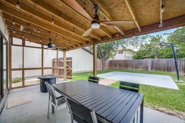 7711 Chatsworth, San Antonio, TX 78250 - fenced backyard featuring ceiling fan, a patio, and outdoor dining space
