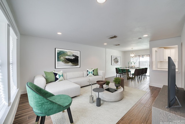 7711 Chatsworth, San Antonio, TX 78250 - living area with dark wood-style flooring, recessed lighting, and a chandelier
