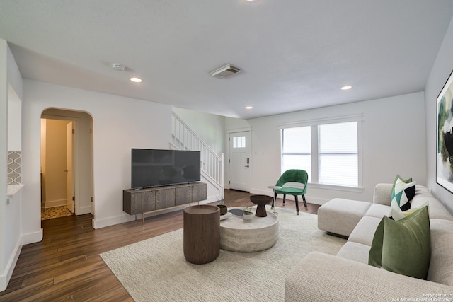 7711 Chatsworth, San Antonio, TX 78250 - living room with stairs, dark wood-style flooring, arched walkways, and recessed lighting