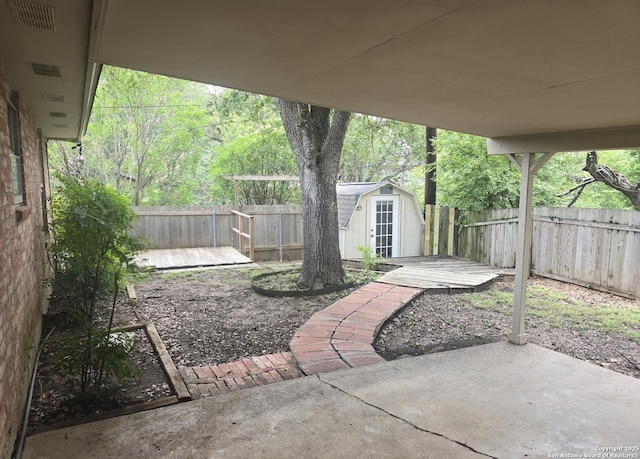 5214 King George, San Antonio, TX 78229 - fenced backyard with a patio and a shed