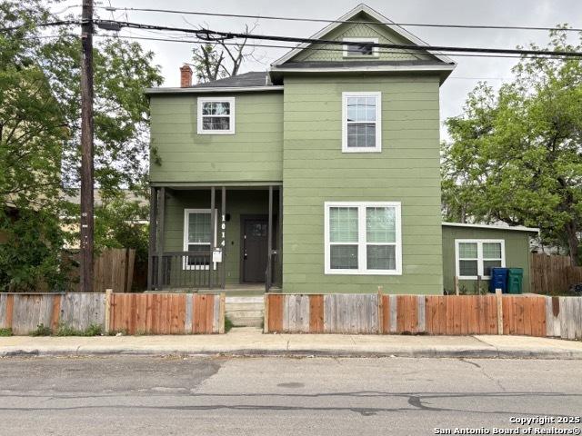 1014 Montana, San Antonio, TX 78203 - view of front of home with a chimney, a fenced front yard, and a porch