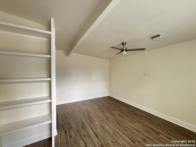 1014 Montana, San Antonio, TX 78203 - unfurnished room with ceiling fan and dark wood-style floors