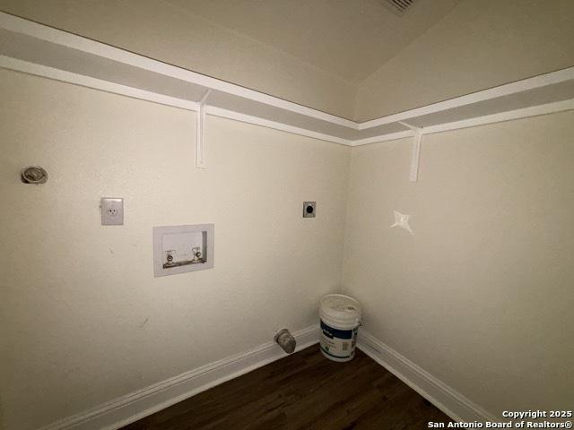 1014 Montana, San Antonio, TX 78203 - laundry room with electric dryer hookup, hookup for a washing machine, and dark wood-type flooring