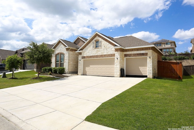 2863 Tortuga Verde, San Antonio, TX 78245 - view of front of home with stone siding, driveway, and an attached garage
